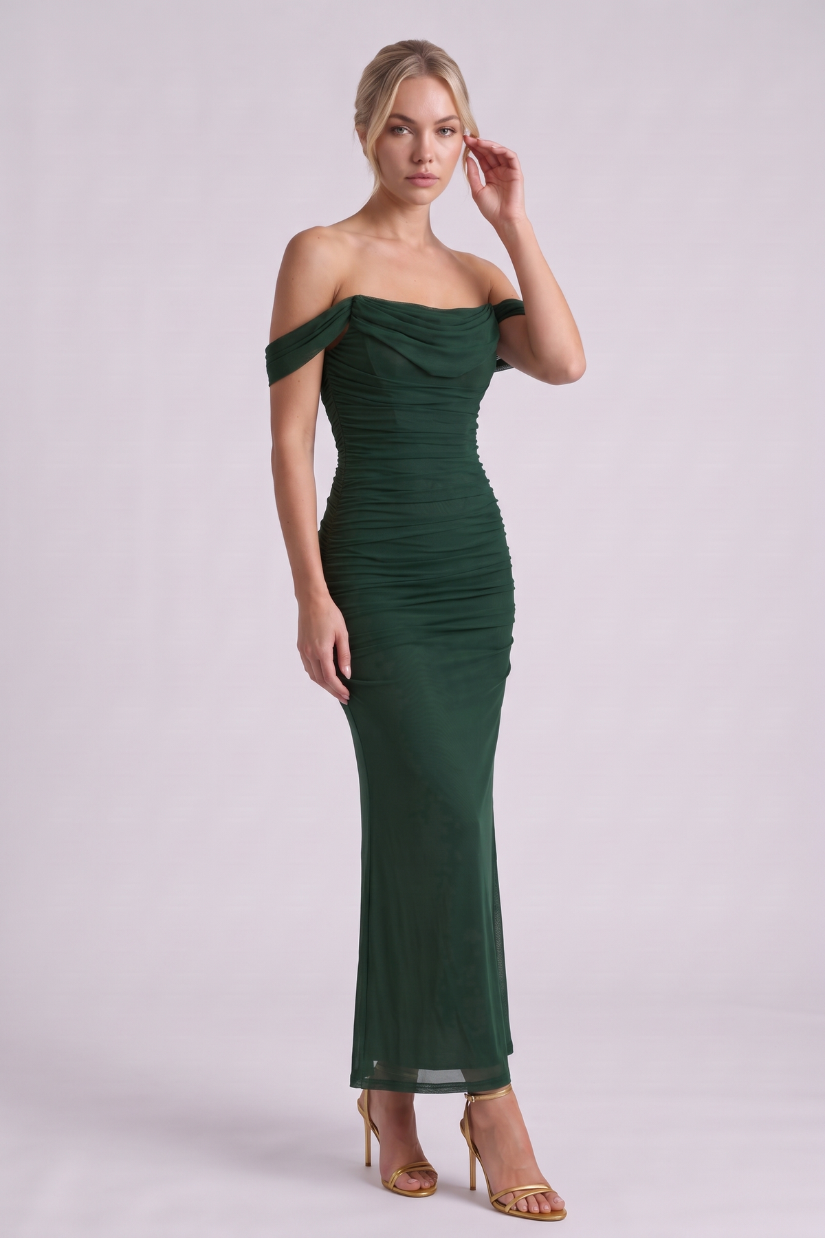 Lucienne Off-Shoulder Ruched Maxi Dress in Dark Green - three-quarter view