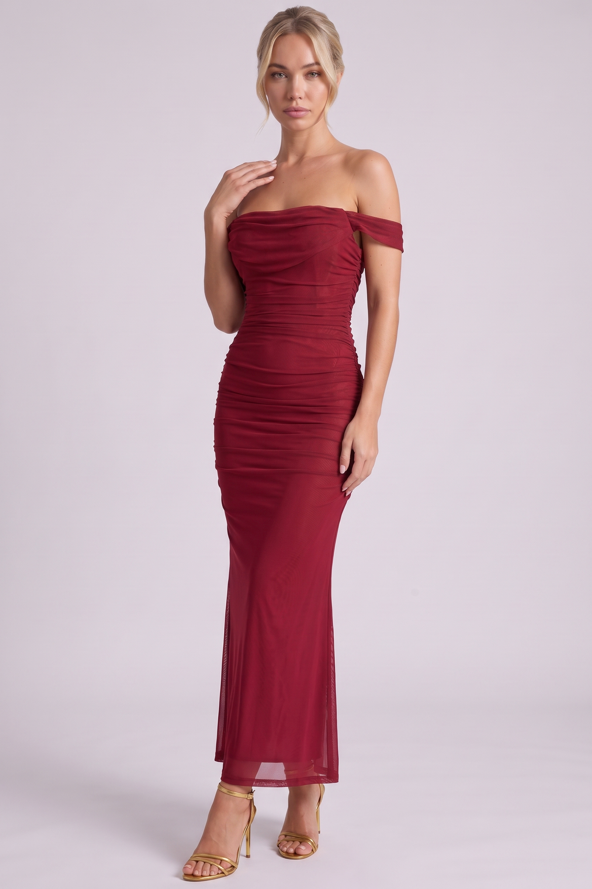 Lucienne Off-Shoulder Ruched Maxi Dress in Wine - three-quarter view