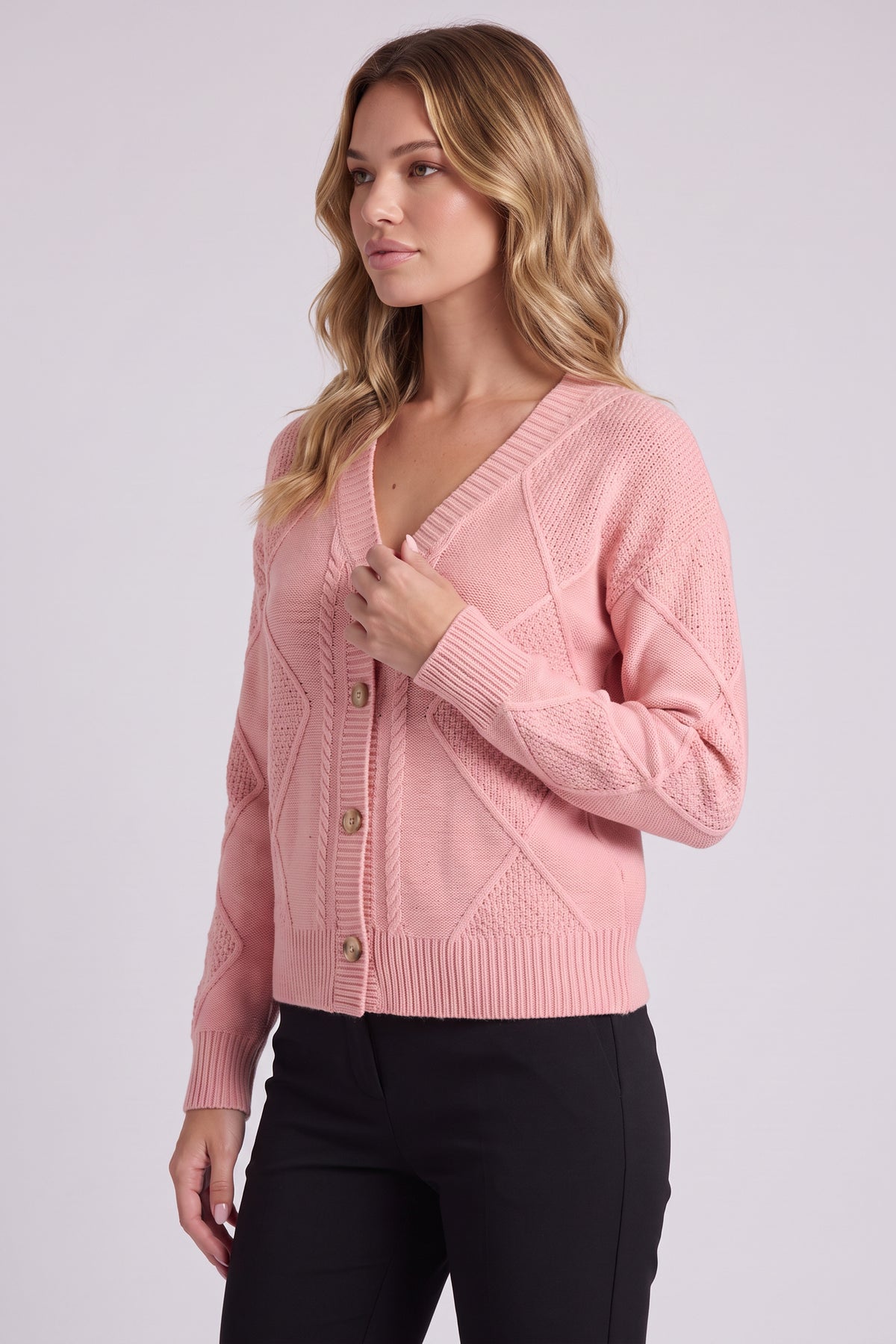 Maren Cable Knit Button Cardigan in Pink - three-quarter view