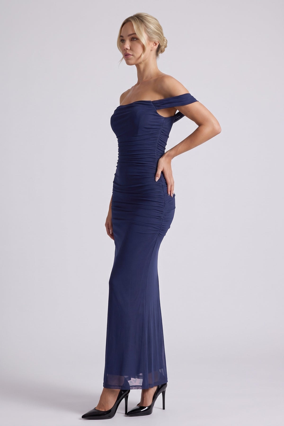 Lucienne Off-Shoulder Ruched Maxi Dress in Navy Blue - three-quarter view