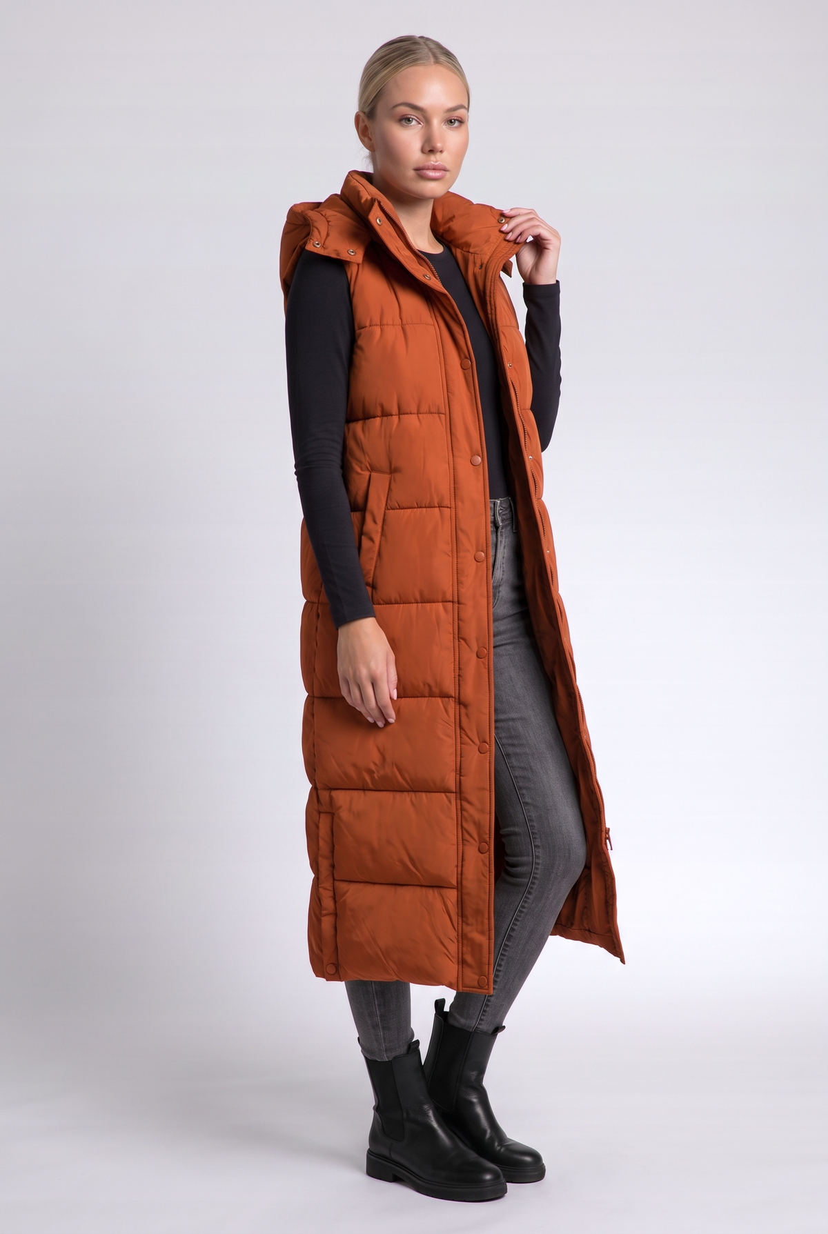 Sabine Puffer Vest in Orange - three-quarter view