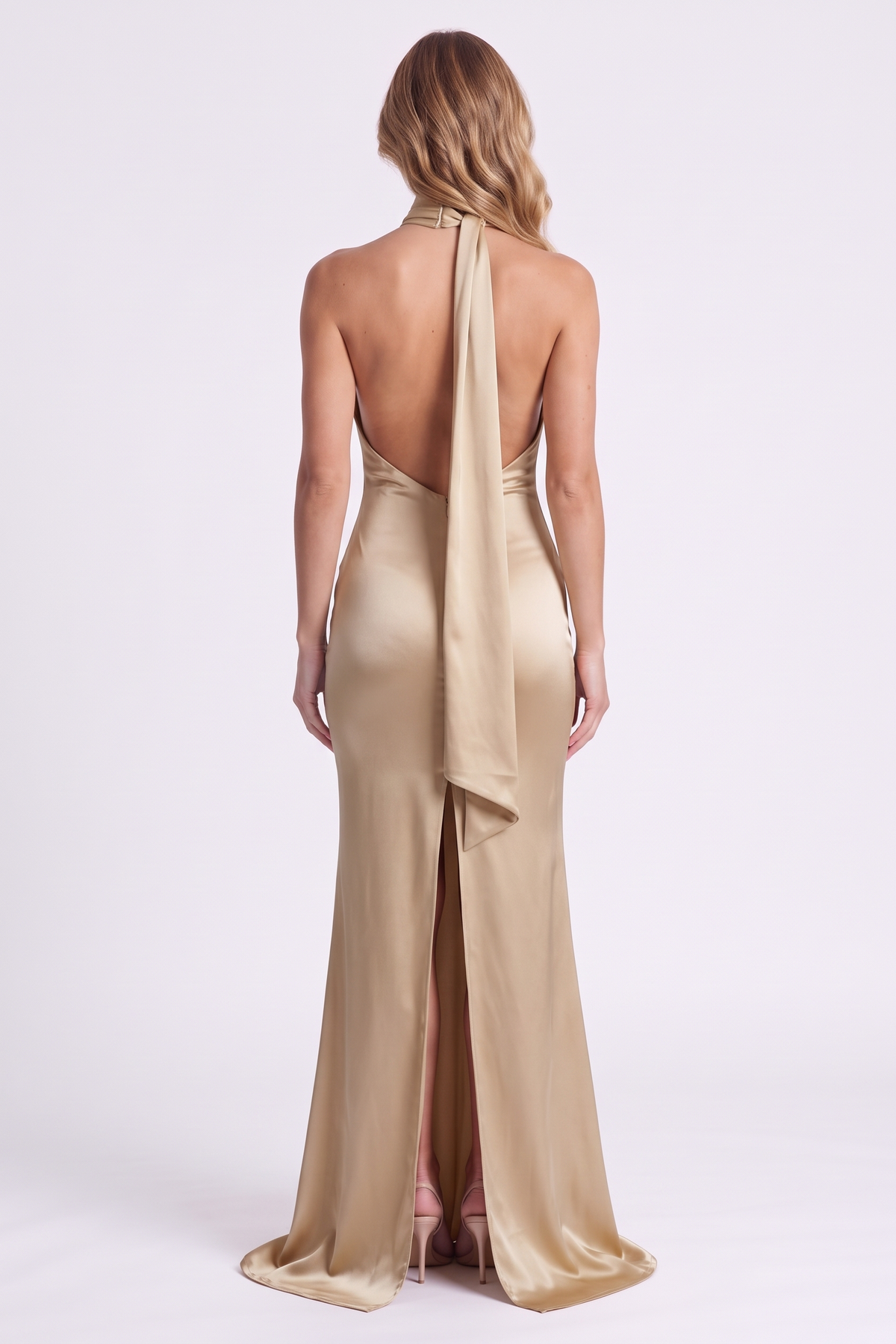 Aurelia Column Gown in Champagne Gold, back view with knee-high slit