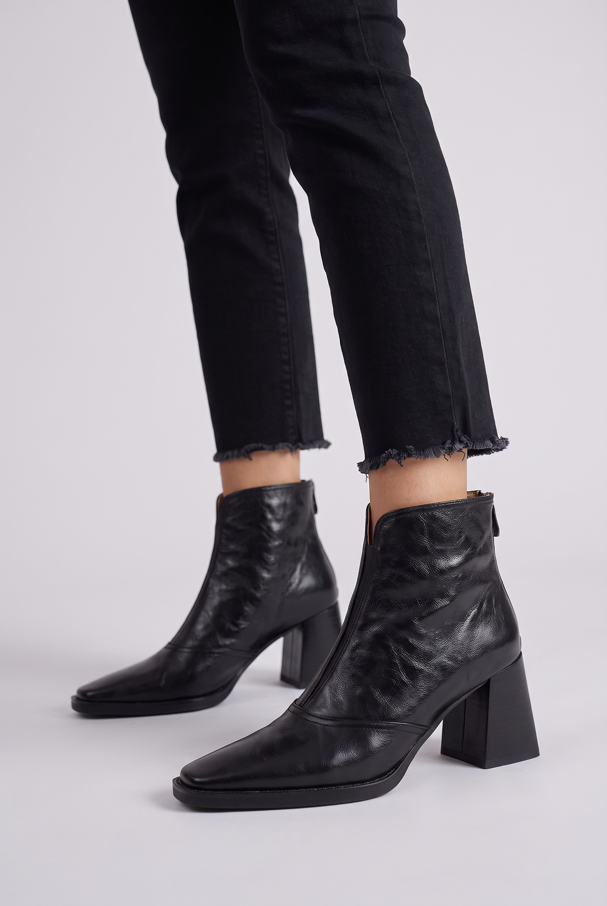Noemi Square Toe Ankle Boots in Black, worn, side view