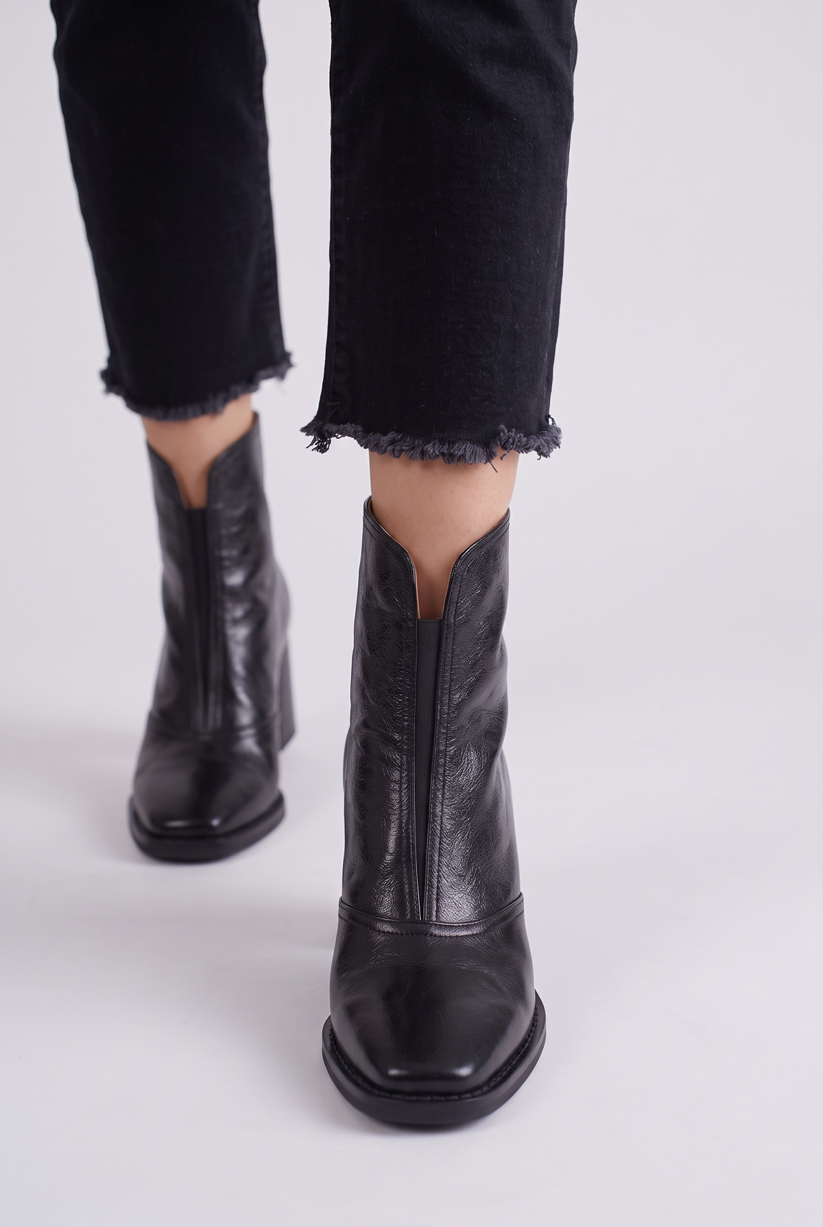 Noemi Square Toe Ankle Boots in Black, front view, worn