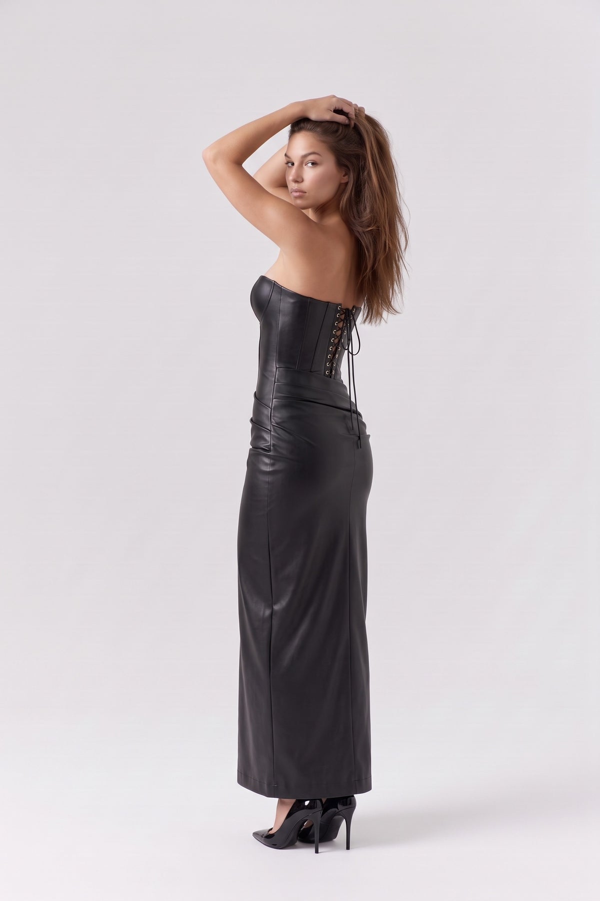 Scarlett Faux Leather Corset Maxi Dress in black, lace-up back three-quarter view