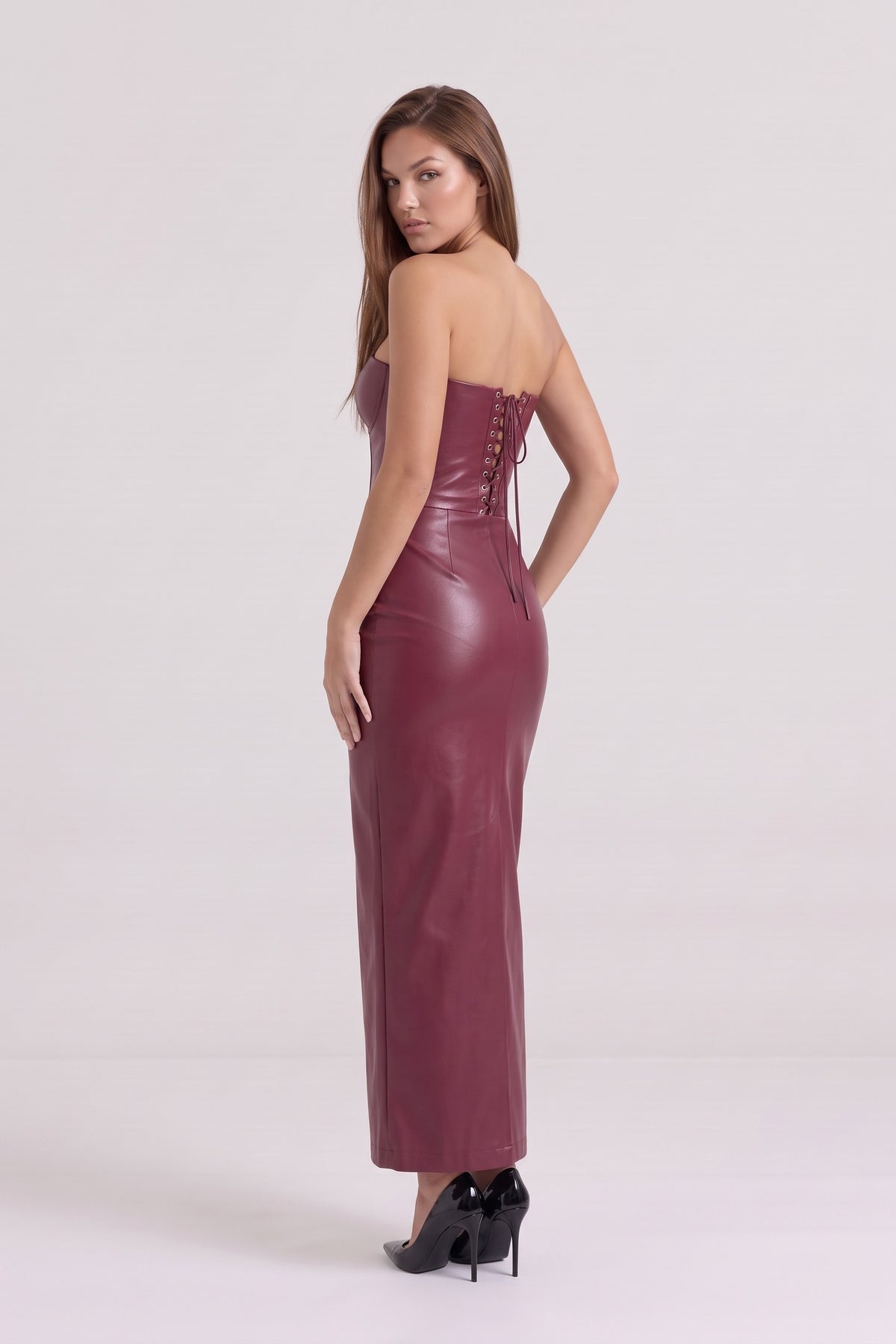 Scarlett Faux Leather Corset Maxi Dress in burgundy, lace-up back three-quarter view